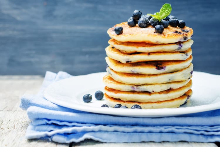 A stack of blueberry pancakes