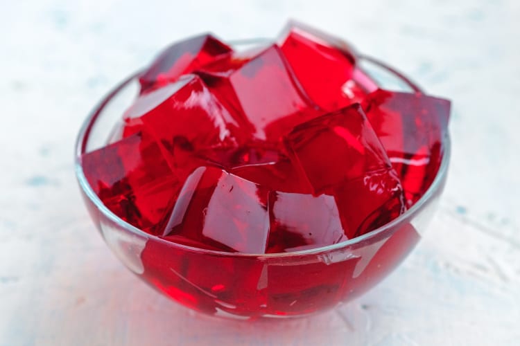 A bowl of red jello cubes
