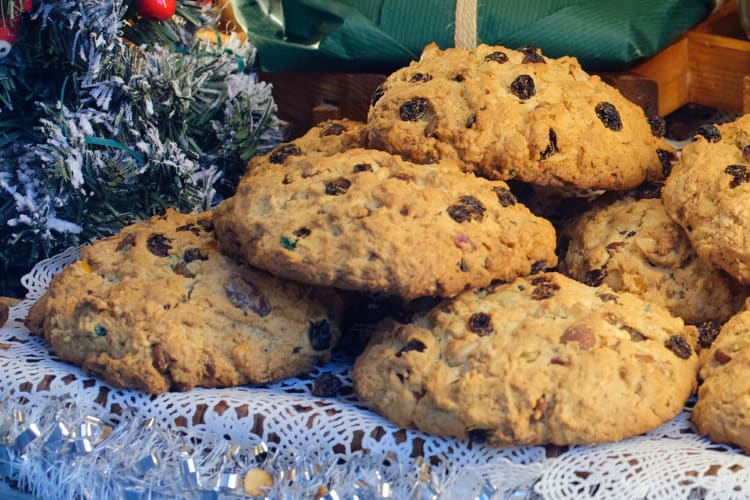 Fruit filled cakes next to Christmas decorations