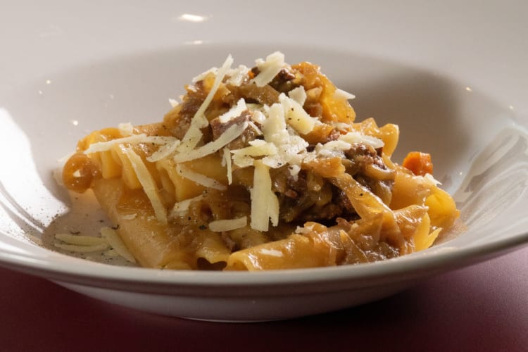 A pasta dish with meat sauce and cheese