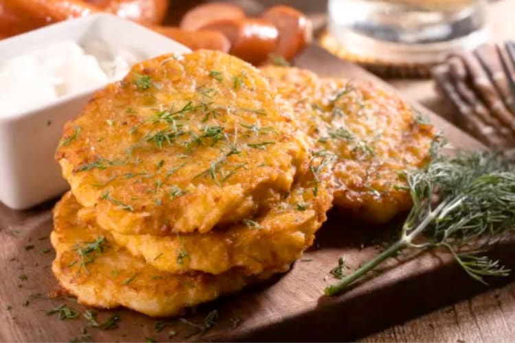 A stack of potato pancakes with dill