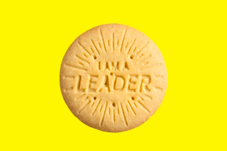A lemon cookie on a yellow background
