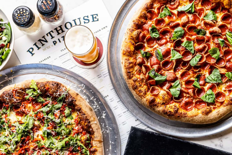 Pizzas and beer on a table