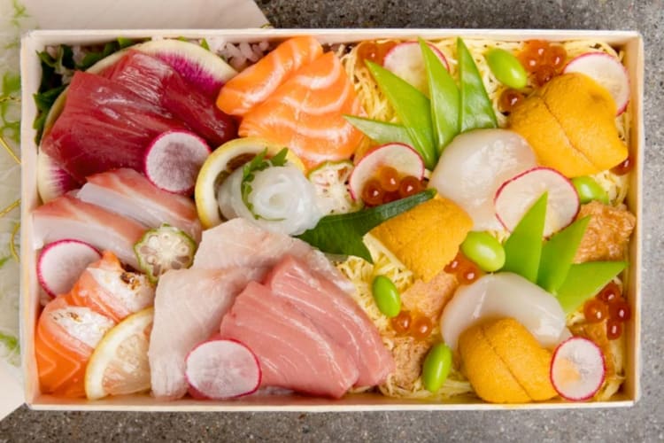 A box of colorful, fresh sashimi