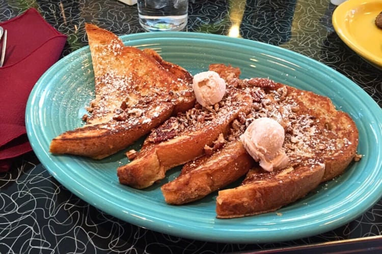 Four slices of French Toast with ice cream on top from Good Morning Mama's 