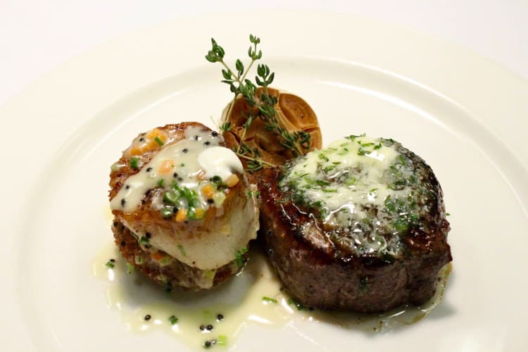 Meal with a piece of steak and scallops from Grace