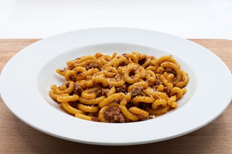 Gramigna alla salsiccia in a bowl