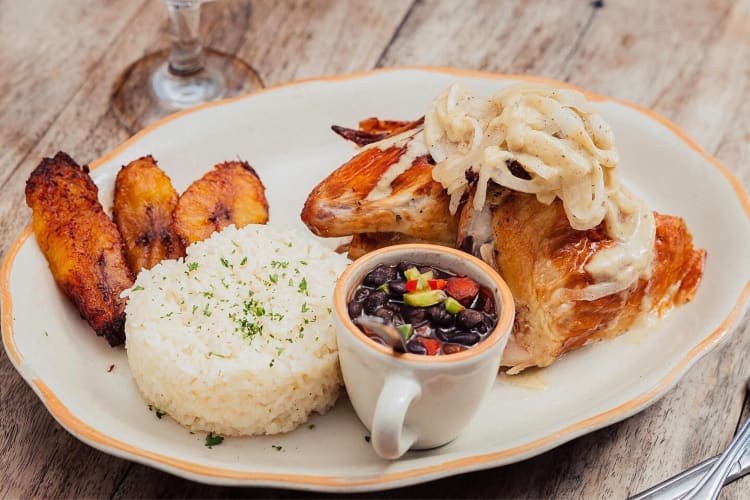 Roasted chicken with plantains, black beans, rice and potatoes from Habana