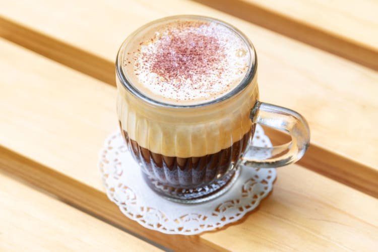 A glass mug of Vietnamese egg coffee