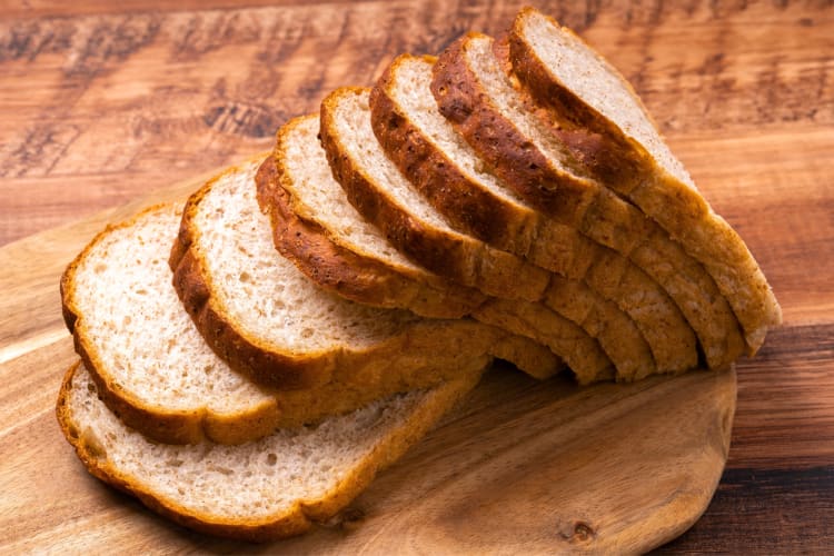 Sliced wholegrain bread on a board