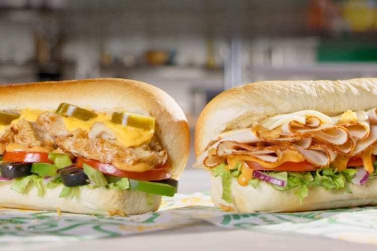 Two Subway sandwiches with different fillings