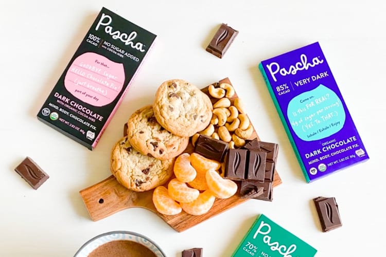 Chocolate bars, cookies and orange segments on a table