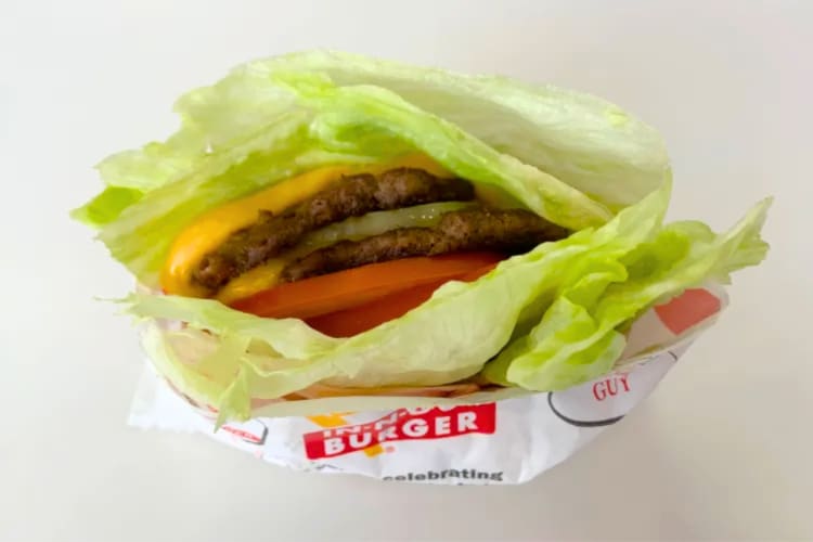 A beef patty, melted cheese, onion and fresh tomato, wrapped up in a refreshing lettuce leaf. 