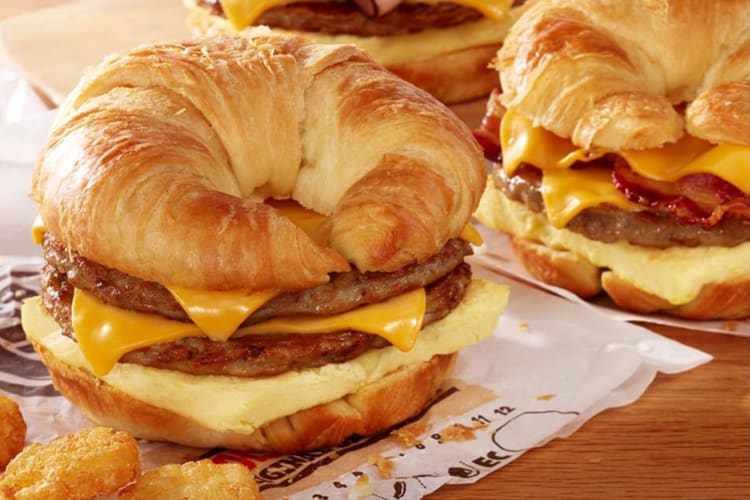 Croissant breakfast sandwich with bacon, egg and cheese