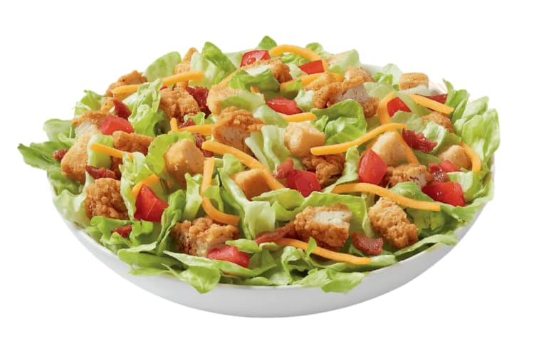 A salad with chicken, tomatoes and cheese