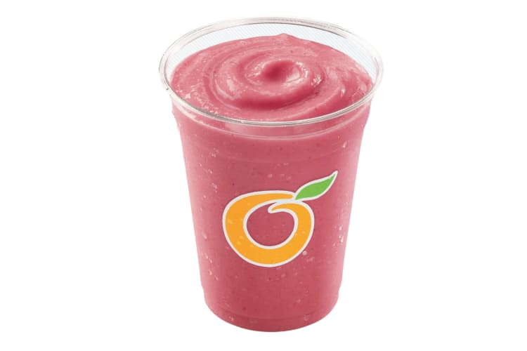 A pink smoothie in a Dairy Queen cup