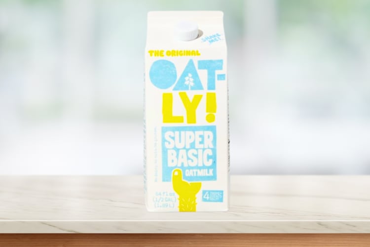 A carton of oat milk on a counter