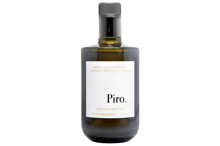  A bottle of Piro Extra Virgin Olive Oil with a white label