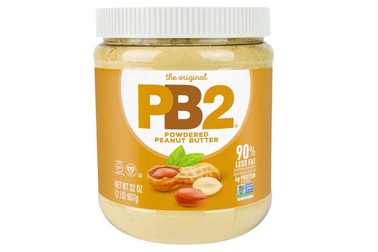 A jar of peanut butter with a yellow logo and peanut design