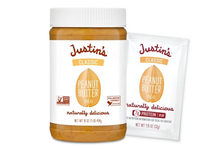 A jar and sachet of peanut butter with white labels