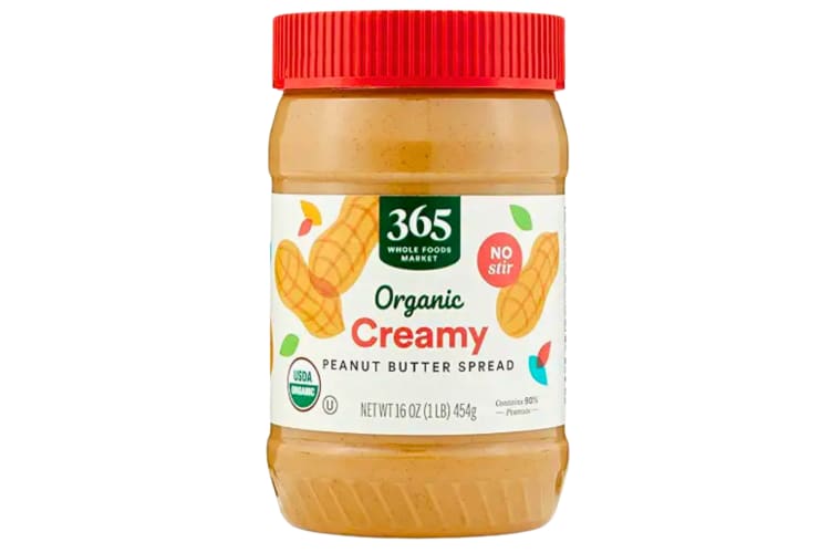 A jar of peanut butter with a red top
