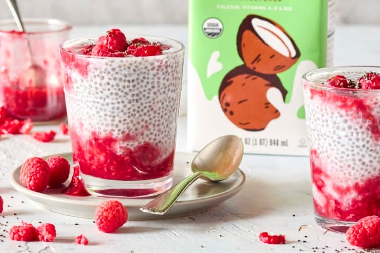 Glasses of chia pudding with fresh raspberries