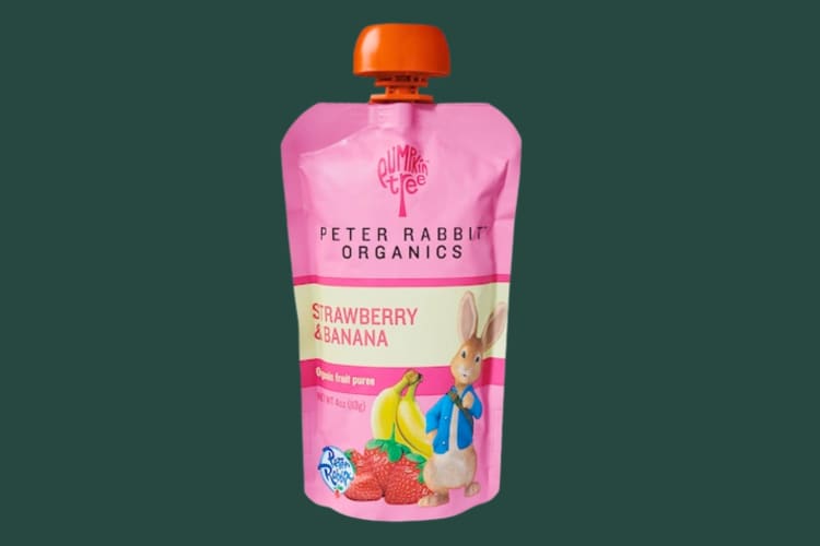 A pink fruit smoothie pouch with a Peter Rabbit character