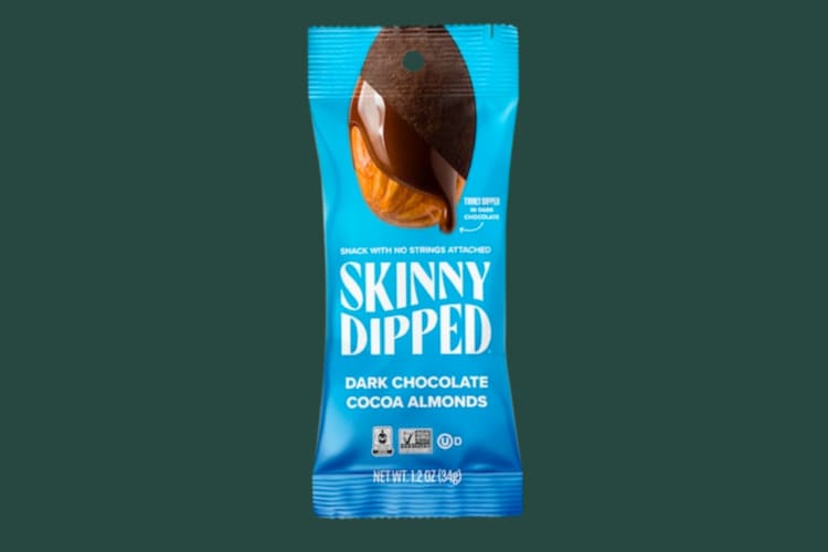 A blue packet of Skinny Dipped chocolate almonds