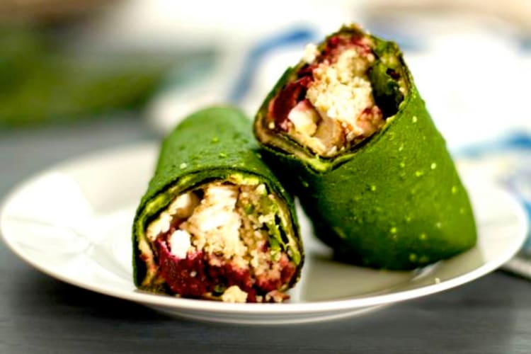 Green tortillas rolled into wraps with a filling