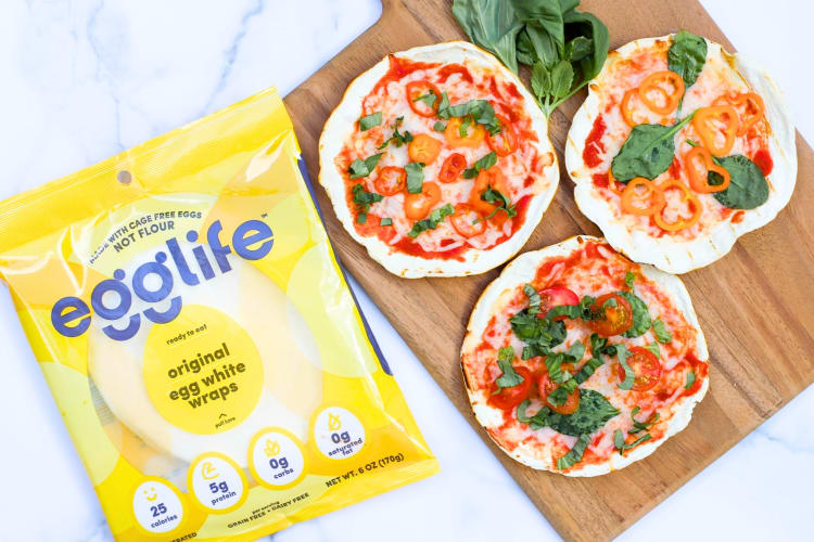 Tortilla pizzas next to a bag of Egglife tortilla wraps
