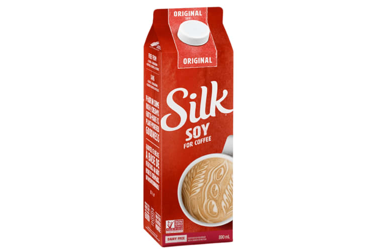 A red container of soy milk coffee creamer