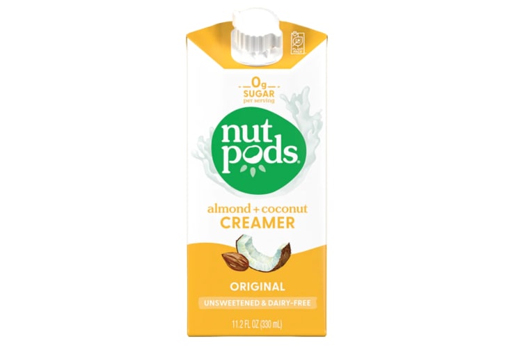 A yellow and white almond and coconut creamer container