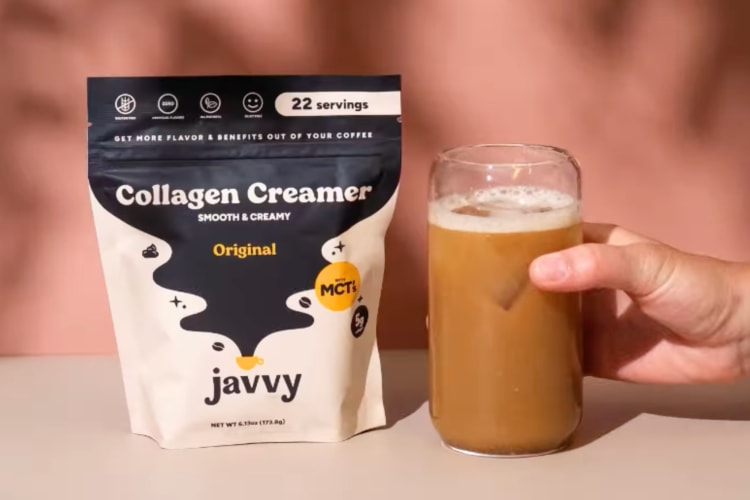A bag of coffee creamer next to an iced coffee drink