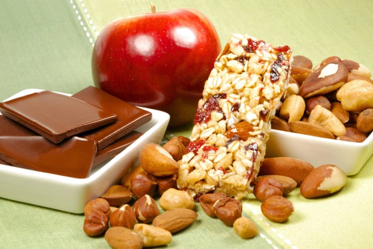 Healthy snacks, including apples, granola bars and nuts 