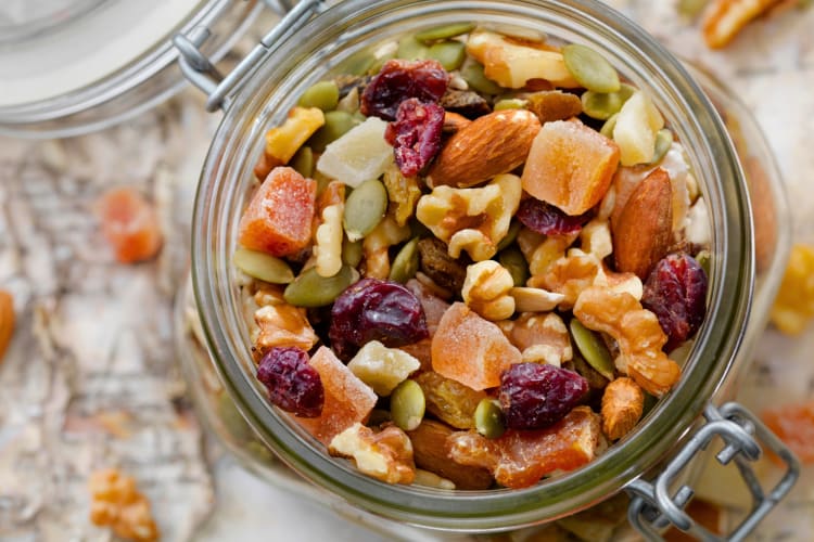 A glass jar of trail mix