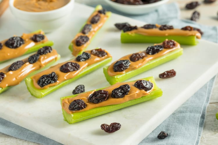 Celery sticks with peanut butter and raisins