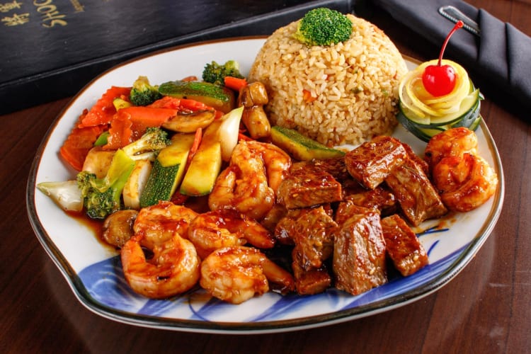 A plate with hibachi steak, shrimp, rice and vegetables