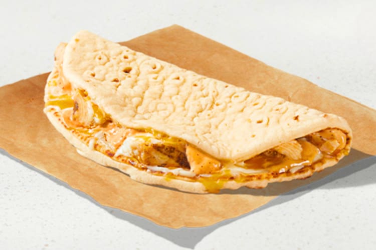 A 3 Cheese Chicken Flatbread Melt is one of the high-protein Taco Bell items