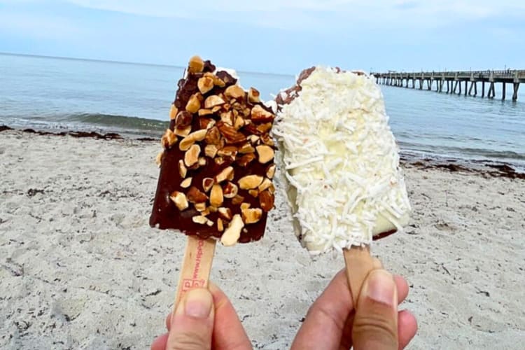 Close-up of two hands holding ice creams from HipPOPs in Miami