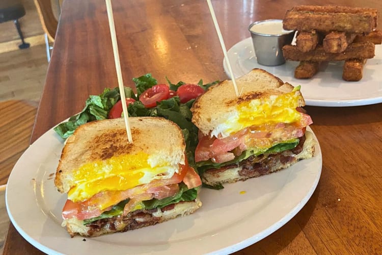 BLT sandwich with French Toast in the background