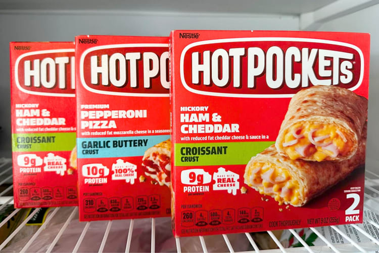 Three boxes of Hot Pockets on a freezer shelf