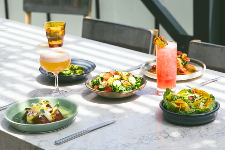 A selection of salads and cocktails on a table