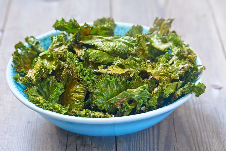 Kale leaves beginning to brown in color, in a bowl