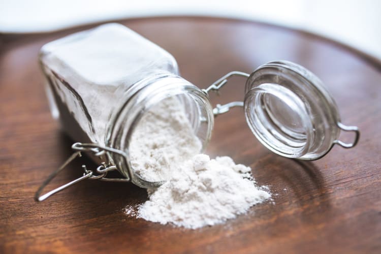 An opened jar of flour.