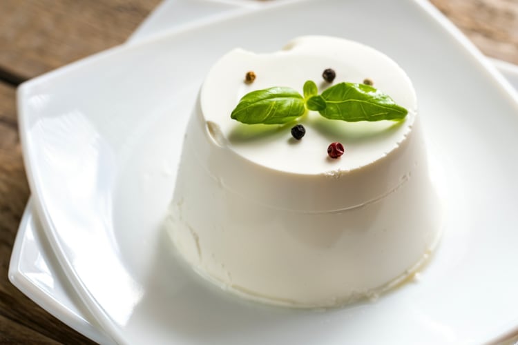 Block of ricotta cheese depicting the answer to the question, 