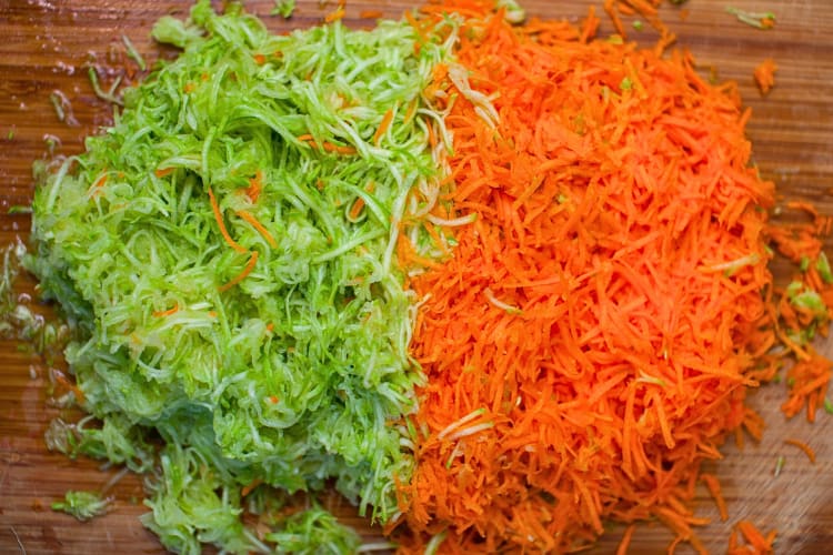 Shredded zucchini and carrot bunches next to each other