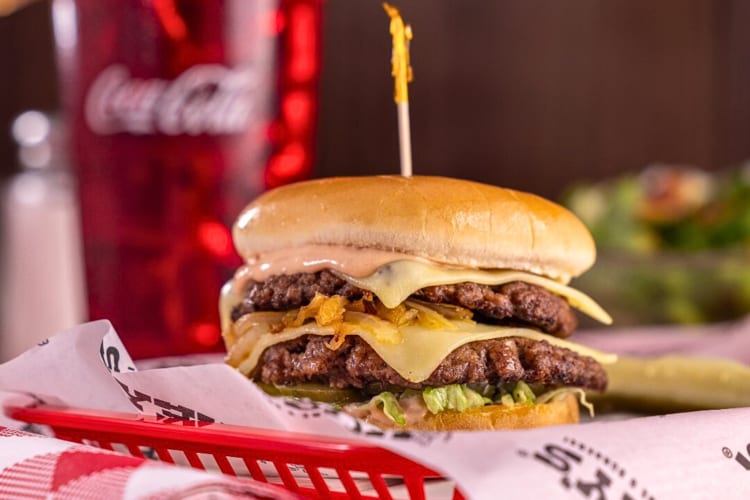 Double-patty cheese smashburger from Huey’s Burger