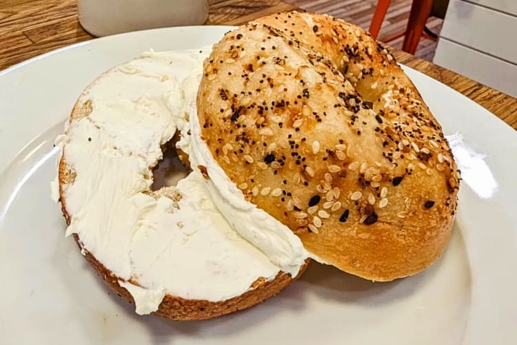 Bagel with cream cheese on from Humble Coffee Company