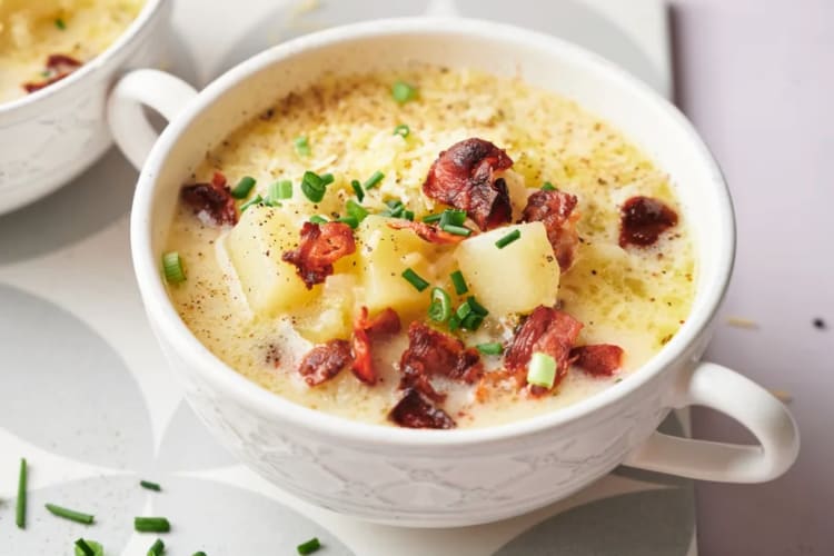 A bowl of potato soup with bacon