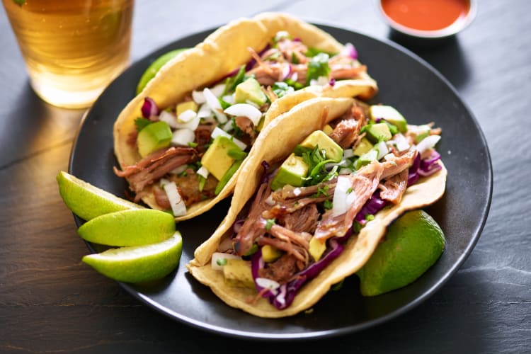 Tacos with pulled pork and avocado